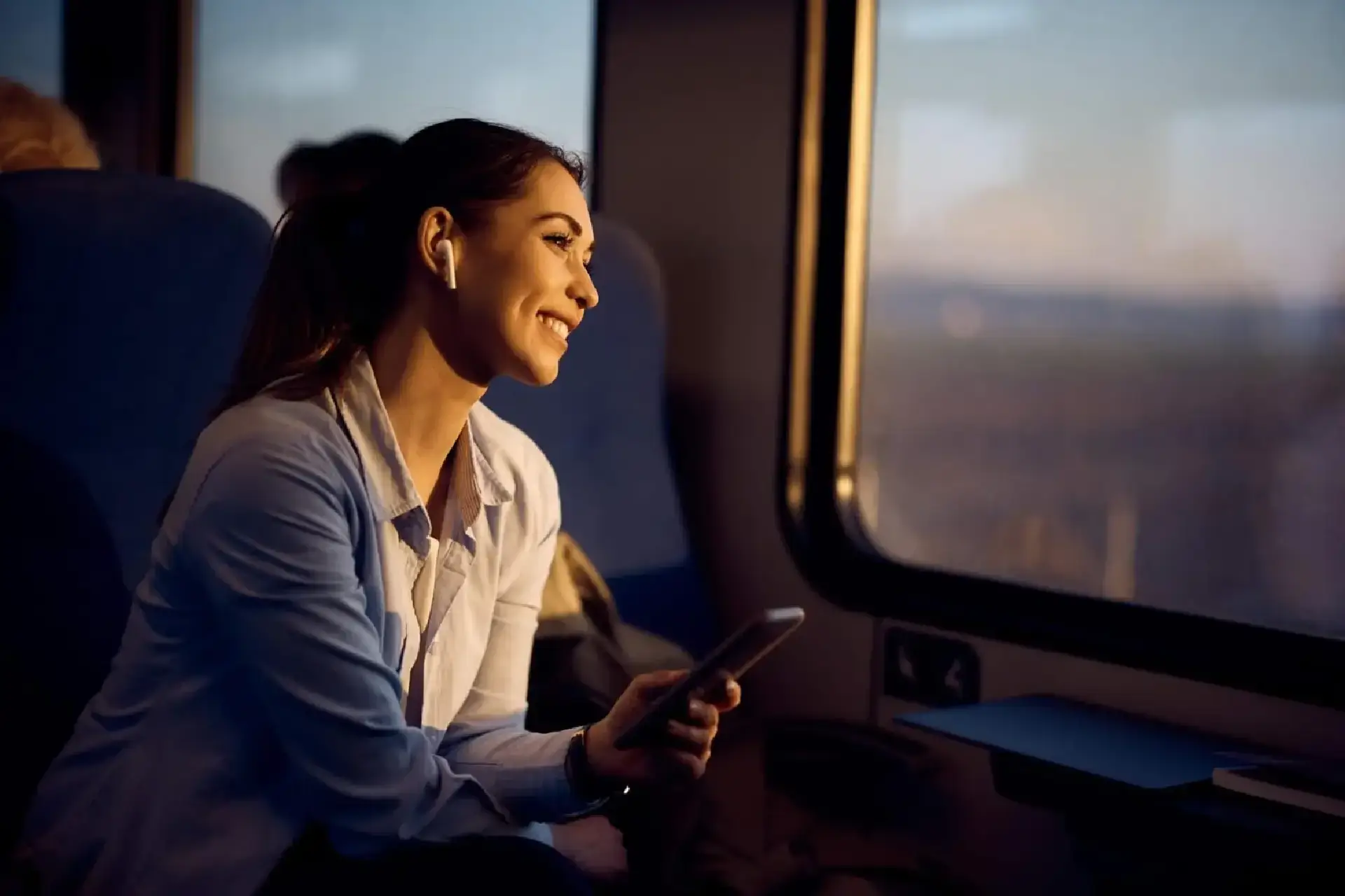 Woman traveling by train in New Jersey using American Car Service for comfortable station transportation.